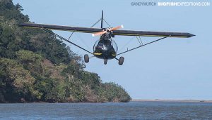 Spotter plane buzzing a boat.