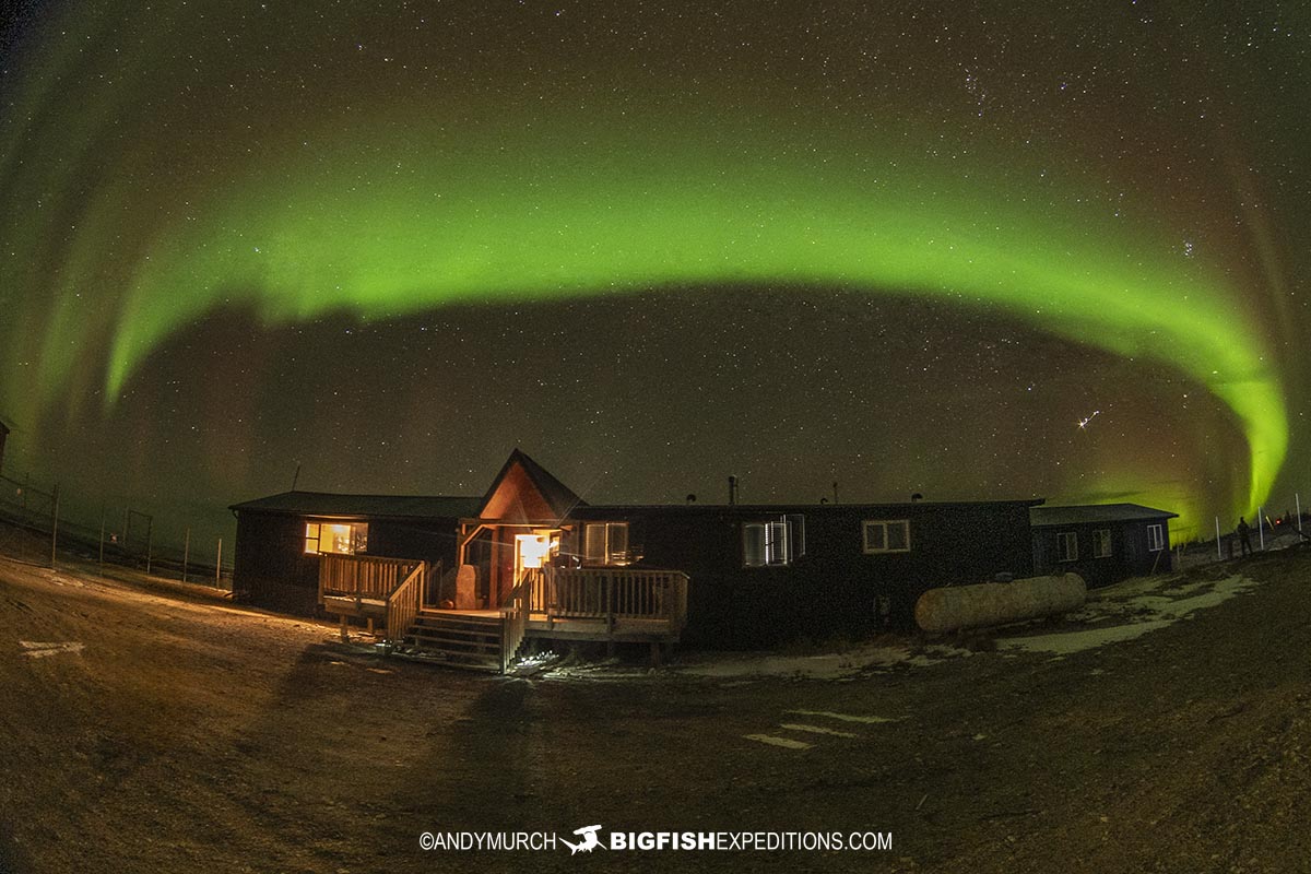 Northern Lights over white whale lodge on the Canadian Tundra.